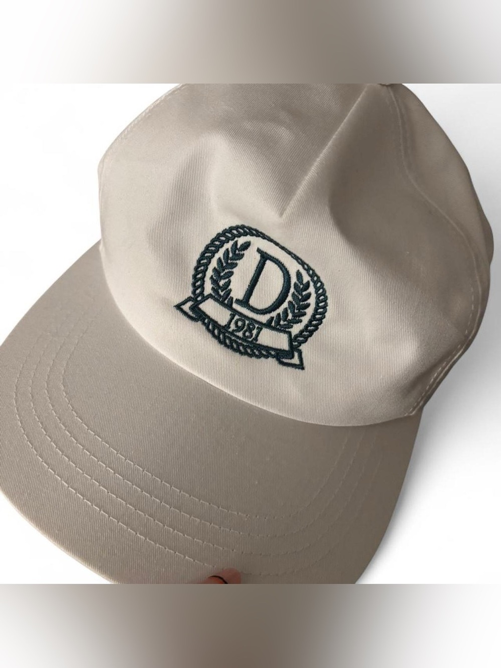 White Danzy hat with green embroidery